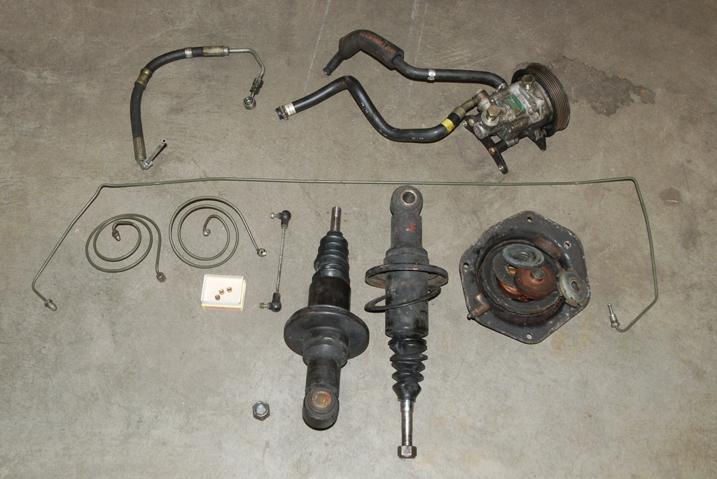 Een schokdemper met niveauregeling met de olieleiding eraan bevestigd